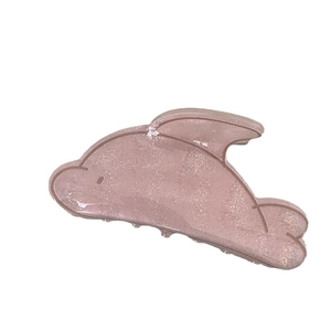Pinkish brown translucent dolphin hair claw clip with a subtle glitter finish for women