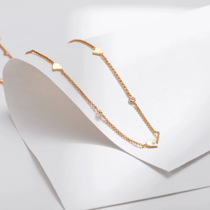Classic 18K gold plated chain necklace featuring elegant heart charms and zircon stones