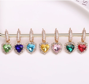 Detail view of heart-shaped earrings in seven colors with sparkling crystal settings