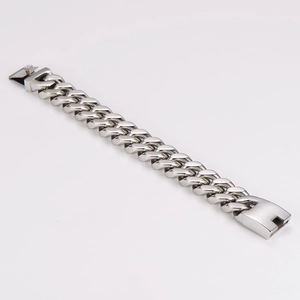 Close-up of silver punk cuban link bracelet with high polished surface and security clasp