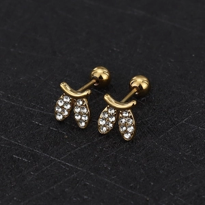 Macro shot of gold threaded stud earrings with cubic zirconia and round screw back