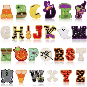 Set of 26 Halloween alphabet embroidery patches with pumpkin and ghost motifs on white