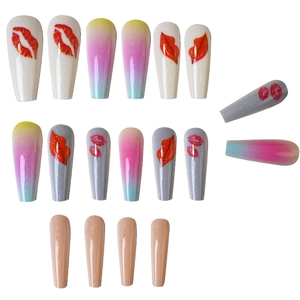 Detail of long coffin press-on nails with red lip prints and gradient glitter designs