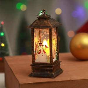 Macro detail of bronze Christmas lantern featuring snowman patterns and warm glowing light