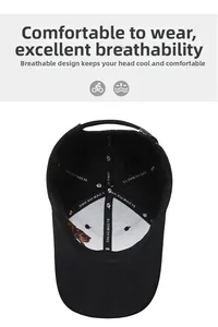 Detailed view of internal reinforced seams and tiger embroidery on a black cotton baseball cap