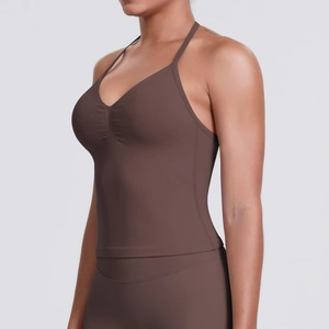 Detail of coffee brown yoga top with V-neckline and gathered front seam detail