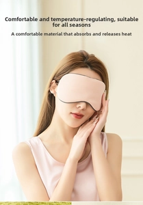 Detail of pink breathable sleep mask on female model showing soft comfort and fit