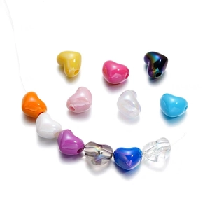 Colorful heart-shaped DIY beads for jewelry making shown in various vibrant pastel colors