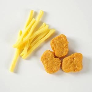 Realistic artificial food set with golden fried chicken nuggets and french fries model