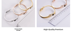 Close-up of sleek stainless steel bracelets with rhinestones showing 6cm diameter size