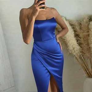 Detail of royal blue satin evening dress with waist ruching and high side slit