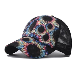 Close-up of colorful daisy print and breathable black mesh on a ponytail baseball cap
