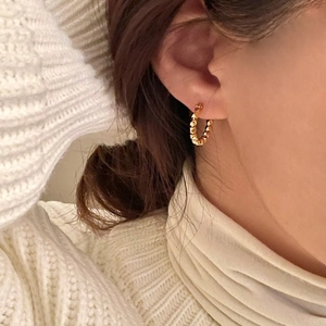 Gold plated 925 sterling silver hoop earrings with a continuous textured heart pattern