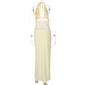 Detail of light yellow backless halter maxi dress with high waist pleats and floor-length