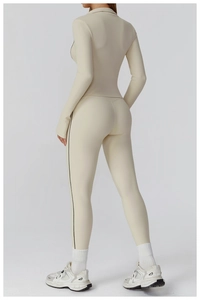 Detail view of high-elasticity yoga set showing ergonomic stitching and slim black side stripes