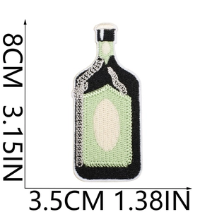 Detail view of a green bottle embroidery patch with size measurements 8cm by 3.5cm
