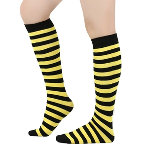 Detail of black and yellow striped knee-high socks showing knitted texture and elasticity
