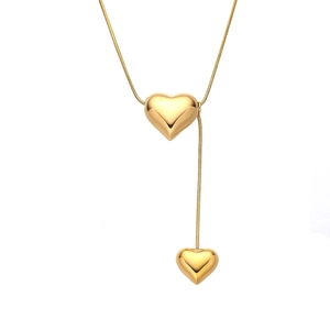 Golden stainless steel heart pendant necklace with snake chain on white background