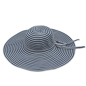 Detailed view of striped sun hat featuring a classic bow and woven texture