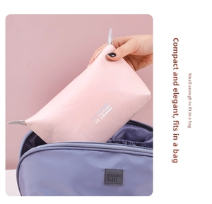 Nesting pink and purple waterproof makeup bags showing spatial storage capacity
