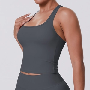Detail of grey racerback yoga top featuring high-elasticity fabric and U-neckline design