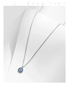 Detailed view of S925 silver evil eye pendant necklace with sparkling zircon pavé