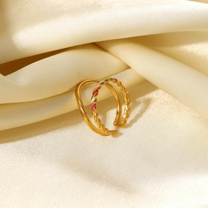 Detail of 18K gold-plated double-layer ring with colorful enamel inlay on silk
