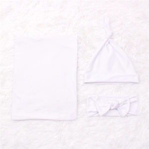 Soft white 3-piece newborn swaddle set including blanket, knotted hat and bow headband