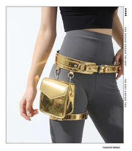 Detail of metallic gold mini waist bag with matching leg strap on grey leggings