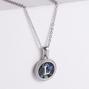 Silver stainless steel necklace with round shell pendant featuring letter L engraving