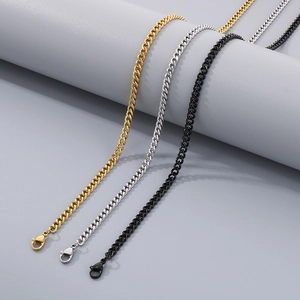 Detailed view of polished stainless steel Cuban chains in gold, silver, and black finishes