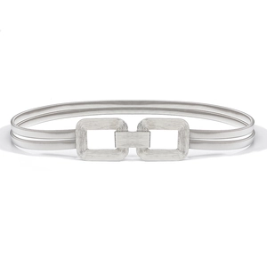 Close-up of elastic silver metal waist belt featuring a brushed rectangular buckle detail