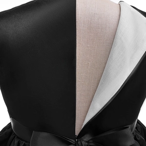 Detail view of girl's Halloween dress featuring a hidden back zipper and satin bow tie