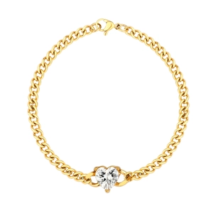Detail of gold Cuban link bracelet featuring a claw-set heart-shaped clear zircon pendant