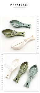 Detailed view of fish-shaped scale scrapers in three colors with transparent lids