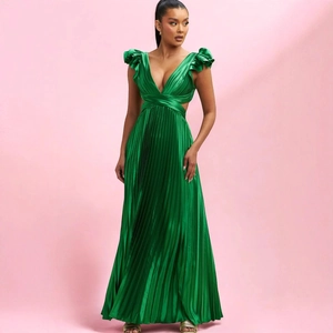 Elegant dark green pleated maxi dress with deep V-neck and high waist on pink backdrop