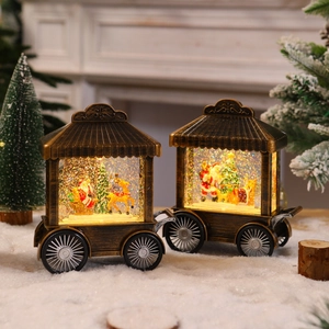 Detail of vintage bronze Christmas cart lantern featuring Santa, reindeer and glitter snow