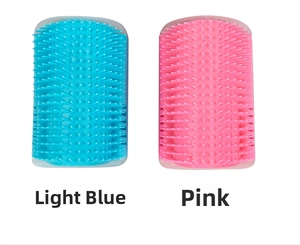 Detail view of light blue and pink cat corner grooming brushes with soft silicone bristles