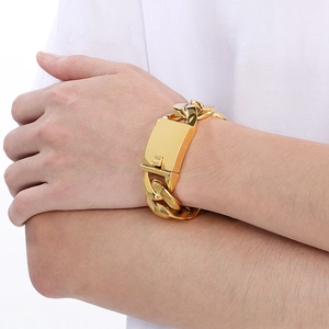 Close-up of a 24mm wide gold-tone Cuban link bracelet in 304 stainless steel on a wrist