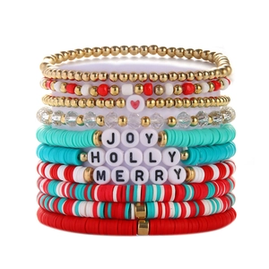 Detail of Christmas beaded bracelet set with JOY and MERRY letter beads and colorful clay