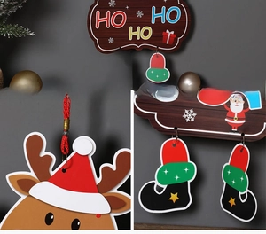 Detailed view of Christmas wooden hanging decorations including Ho Ho Ho sign and reindeer