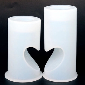 Macro shot of two heart-shaped cylindrical silicone molds for DIY candle making