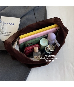 Top-down view showing the large capacity and inner pockets of the brown suede tote bag