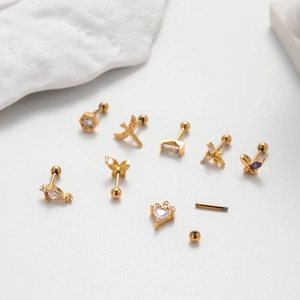 Golden stainless steel stud earrings set featuring butterfly and crown designs with crystals