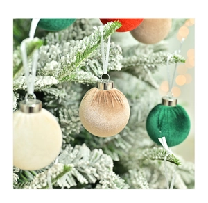 Close-up of velvet Christmas ornaments with vertical texture on snowy tree branches