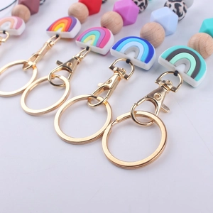 Silicone bead lanyard keychain with rainbow charm and wooden accents for ID card badge