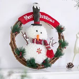 Christmas snowman rattan wreath with Merry Christmas banner and pine cones for wall decor