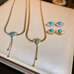 Retro fan-shaped stainless steel jewelry set with blue faux stone and textured finish