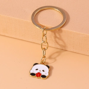 Close-up of gold alloy panda keychain with colorful enamel drip oil finish and ring