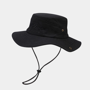 Detail of outdoor sun hat with mountain embroidery, ventilation holes and wind cord